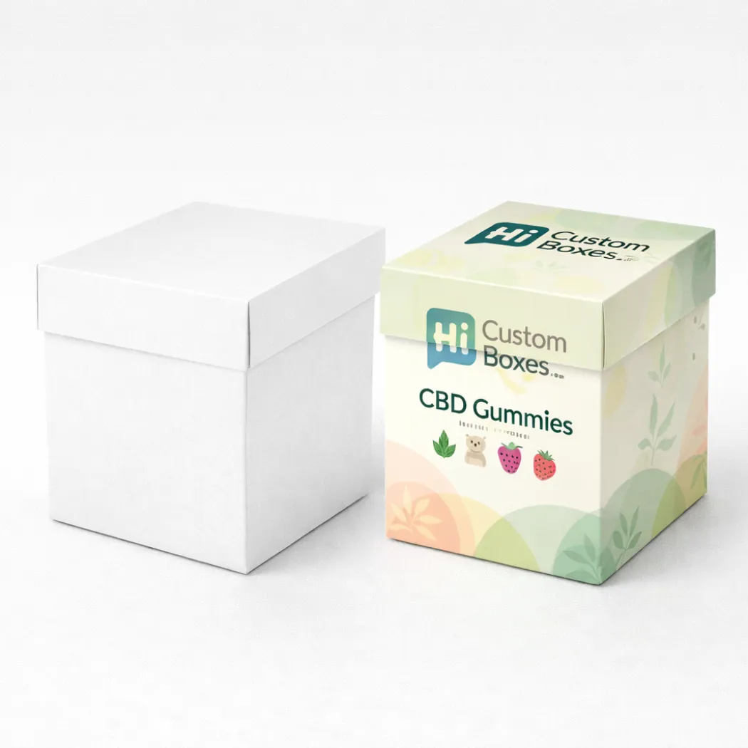 A pair of square boxes- one plain white and one with soft pastel wave-like illustrations- class=